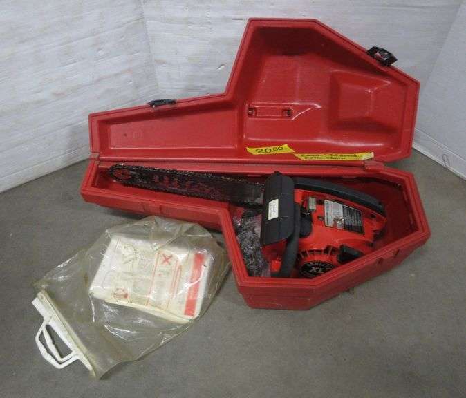 Homelite Textron chainsaw with case, manual, and electric chain, 14