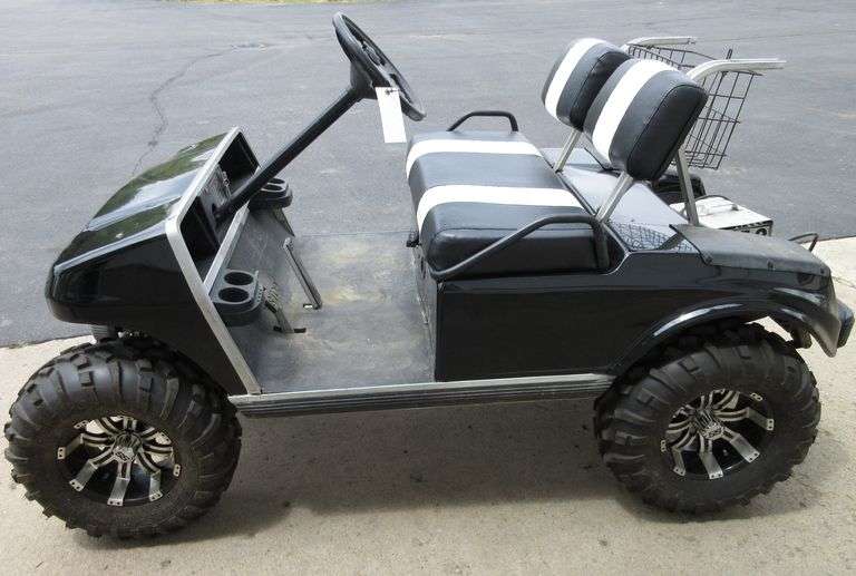 1995 Club Car DS with 6" lift, wrapped in black, battery has 50 to 60