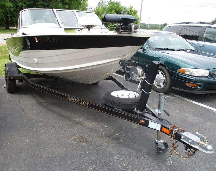 2004 Smoker Craft 16' boat with trailer, fish finder, life vest through cushions, anchor with