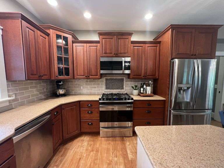 2006 Pioneer cherry kitchen with Cambria quartz countertops