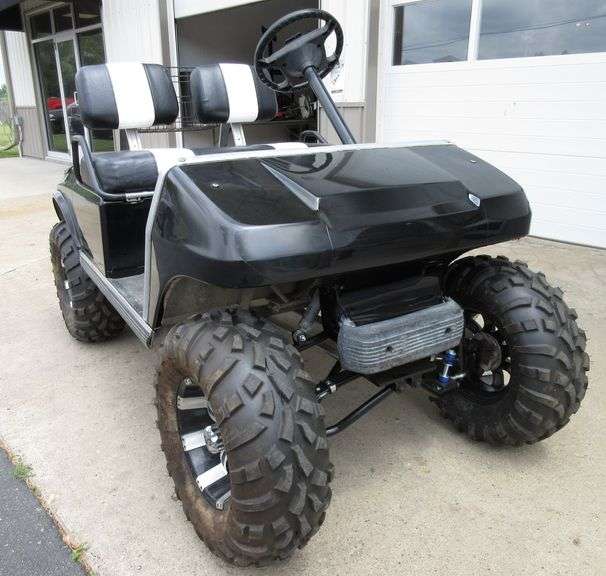 1995 Club Car DS with 6" lift, wrapped in black, battery has 50 to 60
