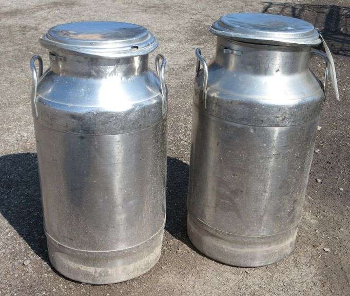 (2) Old stainless steel milk cans, 10"Dia x 20"H, have dents and scratches Albrecht Auction