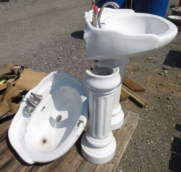 (2) Bathroom pedestal sinks, one has a crack in the bottom of bowl