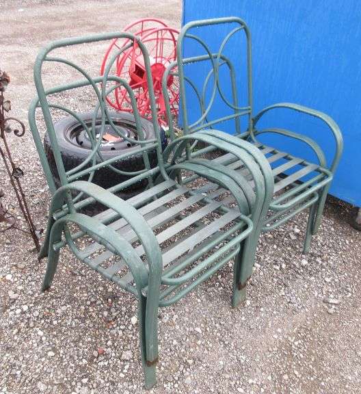(4) Matching patio chairs with no cushions, some light rust, some holes