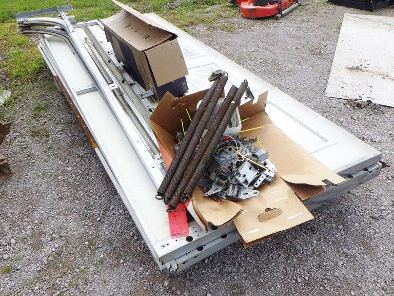 (2) White aluminum garage doors, 9' x 7', complete with hardware and one garage door opener