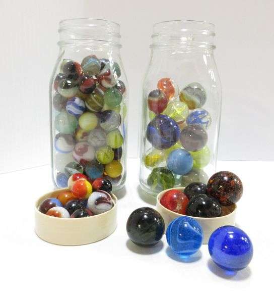 (2) Jars of old marbles, one container has over (100) marbles, other