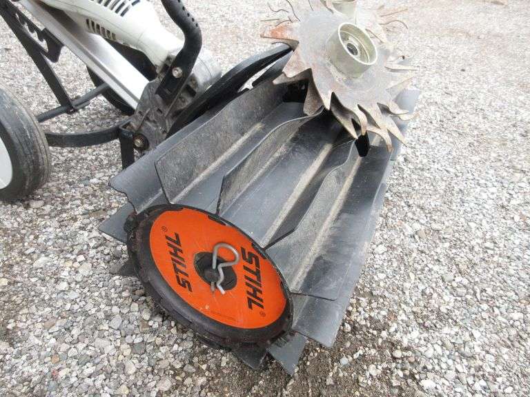 Stihl MM55 gas powered rototiller, includes a rock flicking grass