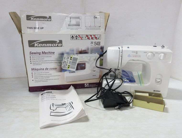 Kenmore sewing machine, includes book and accessories, model 15408, 51