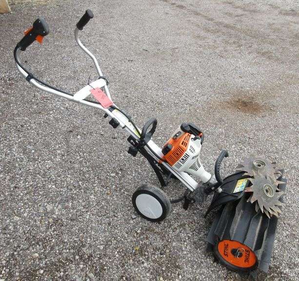 Stihl MM55 gas powered rototiller, includes a rock flicking grass