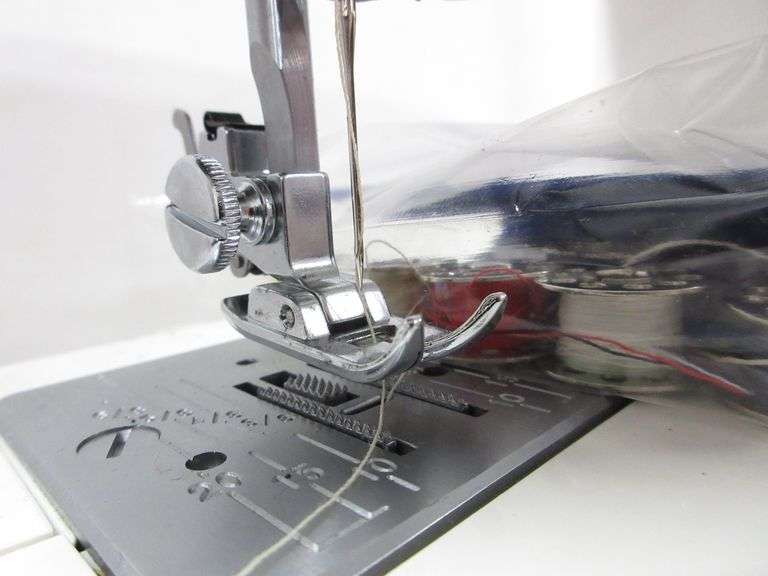 Kenmore sewing machine, includes book and accessories, model 15408, 51