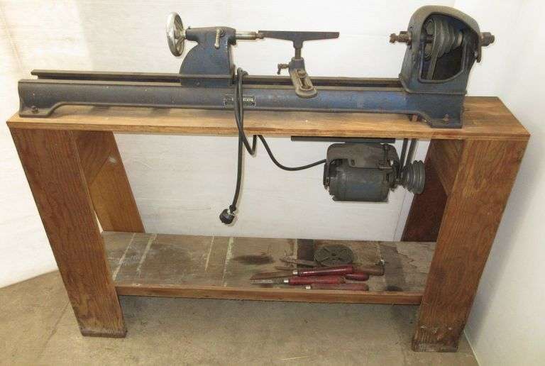 Dunlap wood lathe, 51"W, comes with face plate and (5) chisels, good