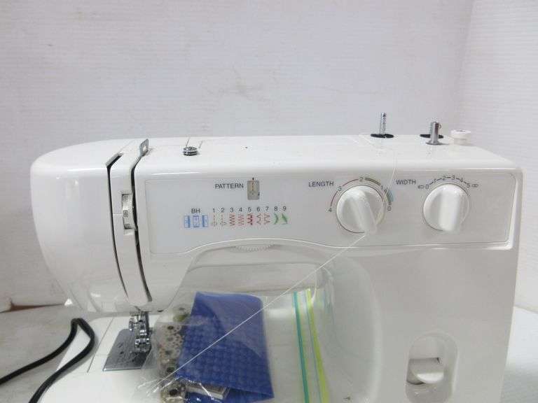 Kenmore sewing machine, includes book and accessories, model 15408, 51