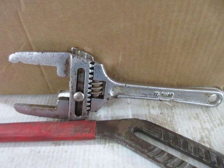 Set of knee pads, large Ridgid crescent wrench, large channel locks, (2