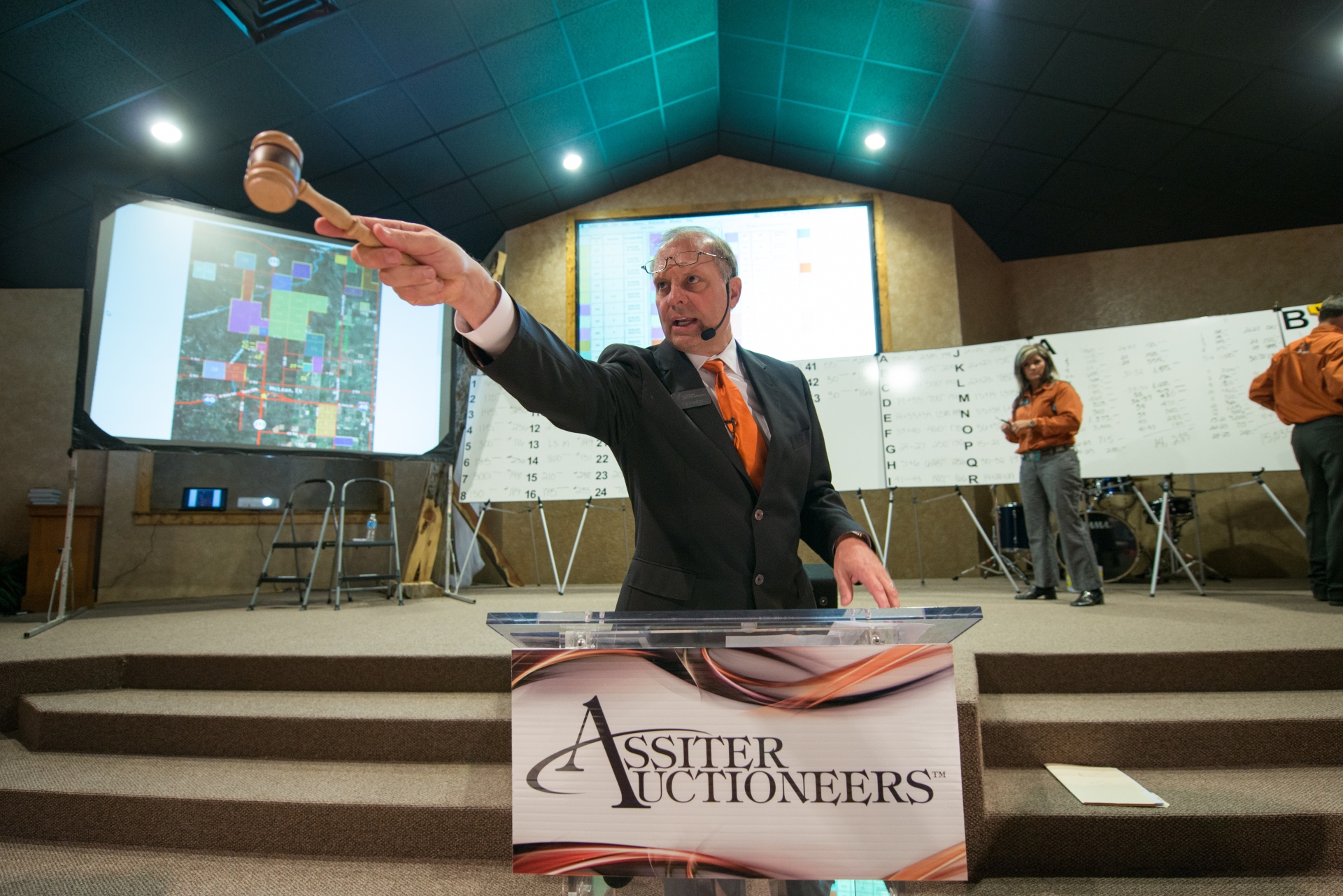 Assiter Auctioneers auctioneer with gavel at podium