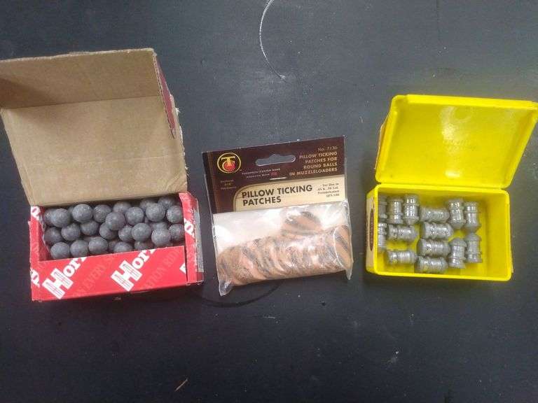 100 pcs 50cal lead ball & 14 pcs Maxi and patches Baer Auctioneers