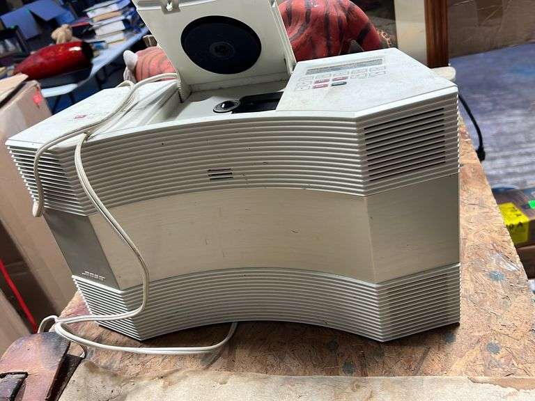 Bose radio/cd player Baker Auctions & Real Estate, LLC