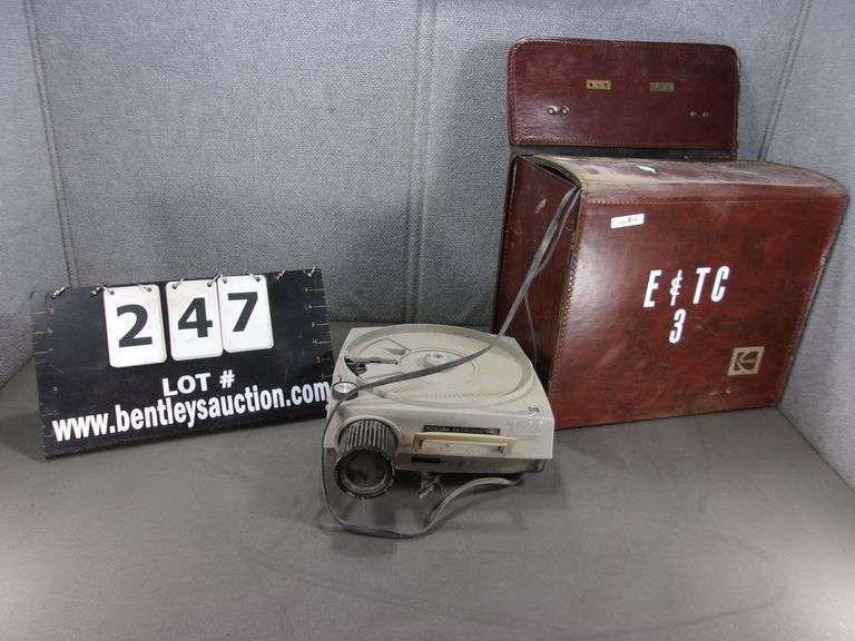 KODAK EKTAGRAPHIC SLIDE PROJECTOR IN RED CARRYING CASE Bentley & Associates, LLC
