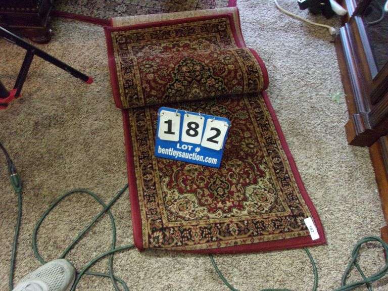 BURGANDY & TAN FLOOR RUG ****LOCATED AT APARTMENT***** Bentley & Associates, LLC