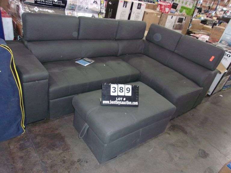 GREY LEATHER L SHAPED COUCH W/ OTTOMAN AND OULL OUT FOOT REST Bentley