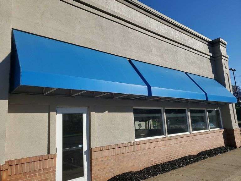 12 ft awning with metal frame, lights, blue vinyl. Look to be an ...