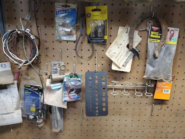 Contents pegboard including thermocouple, wire, threadlocker, auto
