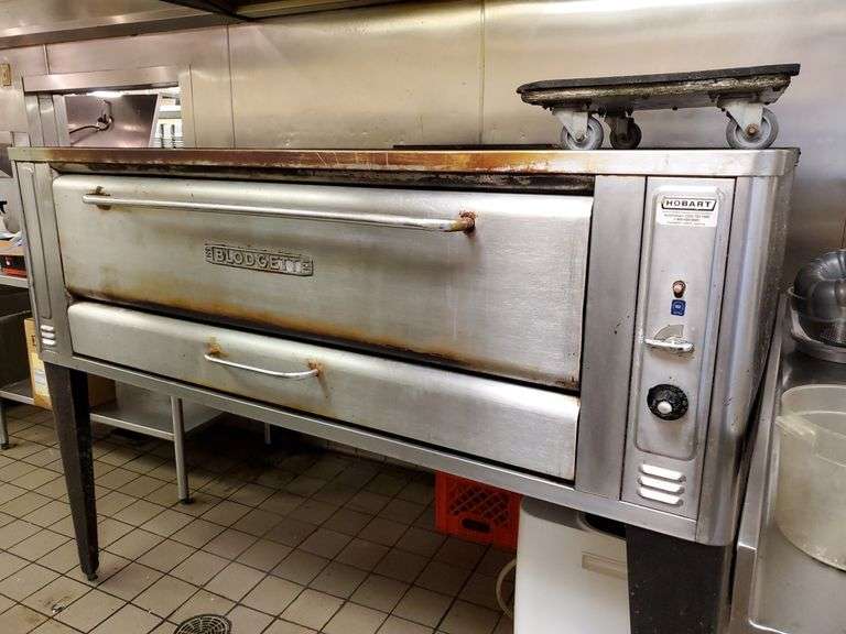 Blodgett model 1000 gas single deck pizza oven supported by angle iron