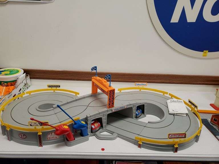 Fisher Price radio control raceway with two cars and track BidAssets