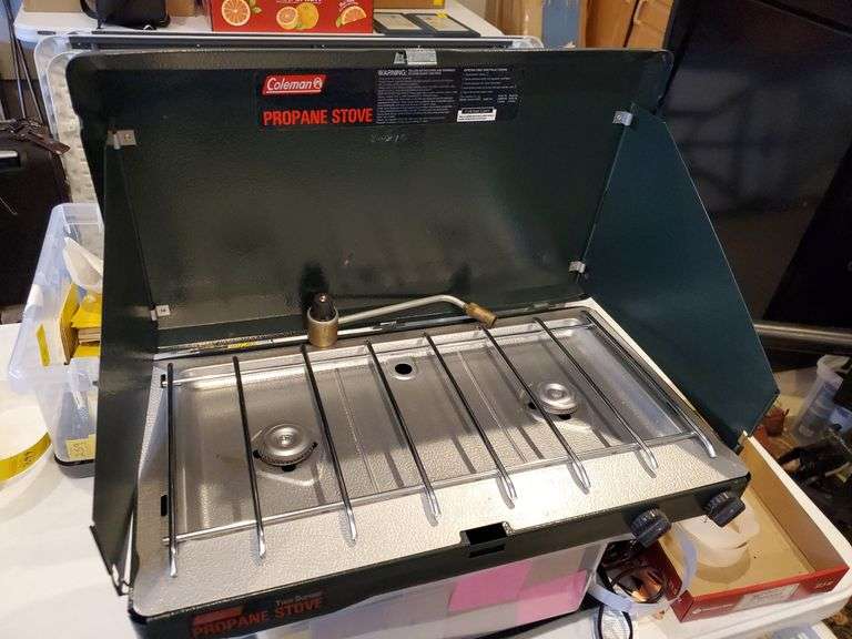 Coleman propane stove, two burner. Appears new...garage BidAssets