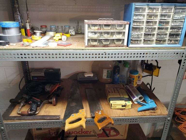 Two shelves including screws nuts bolts caddy, soldering flux and wire