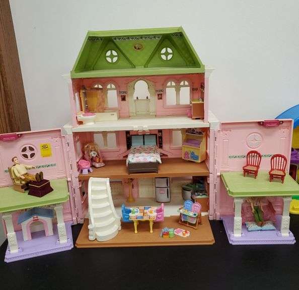 FisherPrice foldable plastic dollhouse with figures and furniture