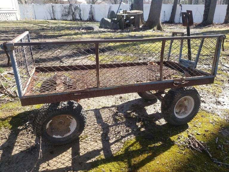 Pneumatic tire garden cart. Includes towbar backyard BidAssets