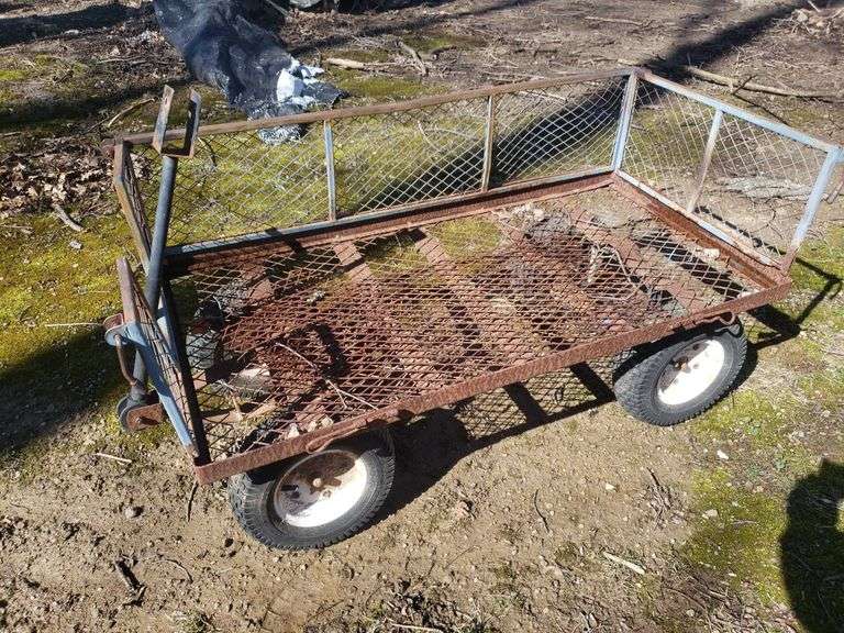 Pneumatic tire garden cart. Includes towbar backyard BidAssets