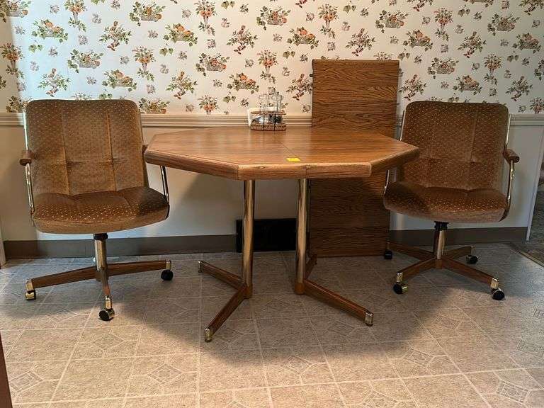 41” octagon Formica top table with 18” leaf and 4 swivel