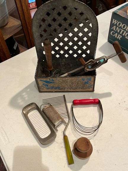 Vintage kitchen utensils and decorative tin basket