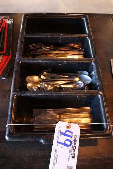Silverware bus tube with some silverware - Backes Commercial Auctioneers
