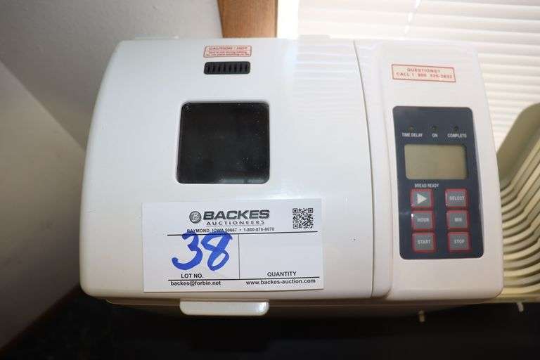 Oster 4811 bread maker with slicing guide Backes Commercial Auctioneers