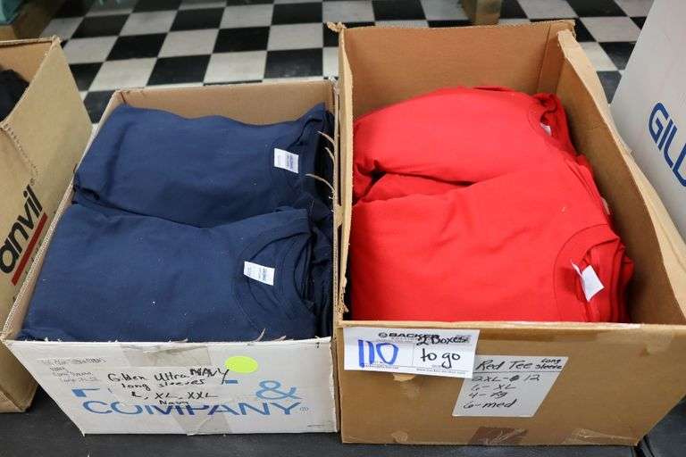 2 boxes to go - Assorted size & brand of red & navy T-shirts