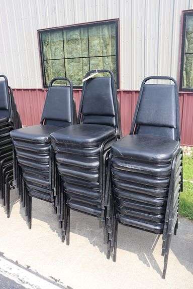 Times 24 - Black metal framed black vinyl seat & back padded stack chairs - minor rips & knicks on edges - overall good looking chairs