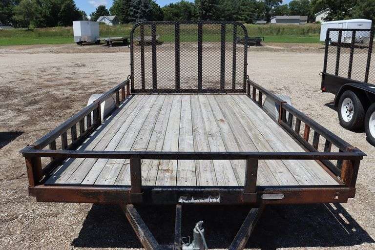 2011 P&J 12 ' - 3,500# single axle utility trailer w/ rear fold down ramp, 10" steel side rails, removable front side ramps, new tires, 2" ball hitch, Vin # 4P5U8121XB2164276