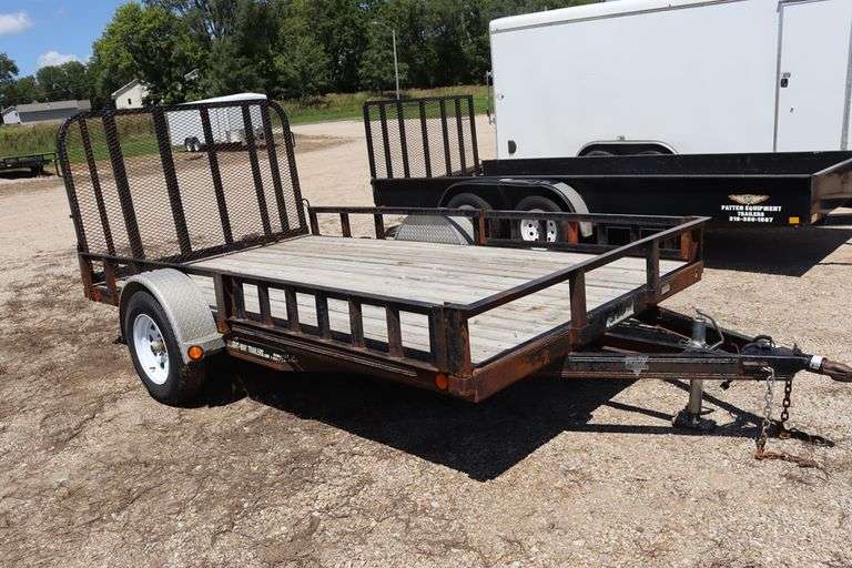 2011 P&J 12 ' - 3,500# single axle utility trailer w/ rear fold down ramp, 10" steel side rails, removable front side ramps, new tires, 2" ball hitch, Vin # 4P5U8121XB2164276
