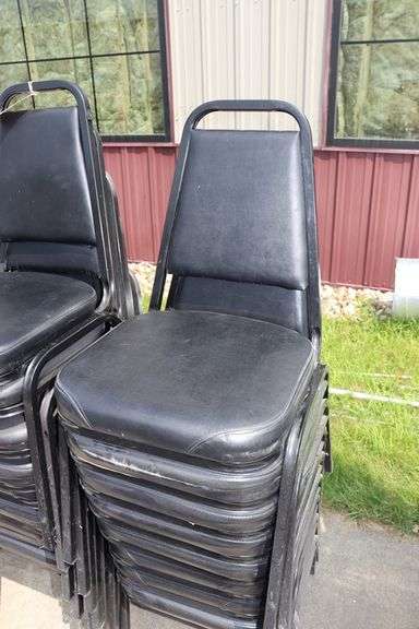 Times 24 - Black metal framed black vinyl seat & back padded stack chairs - minor rips & knicks on edges - overall good looking chairs
