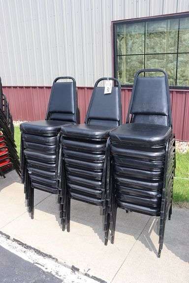 Times 24 - Black metal framed black vinyl seat & back padded stack chairs - minor rips & knicks on edges - overall good looking chairs