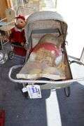 Vintage baby carriage with doll