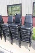 Times 24 - Black metal framed black vinyl seat & back padded stack chairs - minor rips & knicks on edges - overall good looking chairs