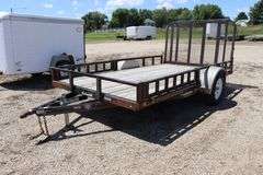 2011 P&J 12 ' - 3,500# single axle utility trailer w/ rear fold down ramp, 10" steel side rails, removable front side ramps, new tires, 2" ball hitch, Vin # 4P5U8121XB2164276
