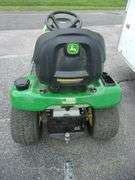 John Deere X310 lawn tractor with 42" deck, 214 hours, has crack in hood, new battery