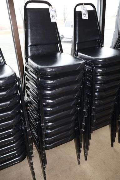 Times 10 - Black metal framed black padded seat & back stack chairs ...