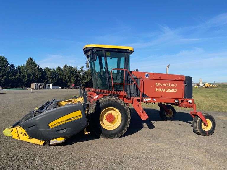 New Holland HW320 Swather Booker Auction Company
