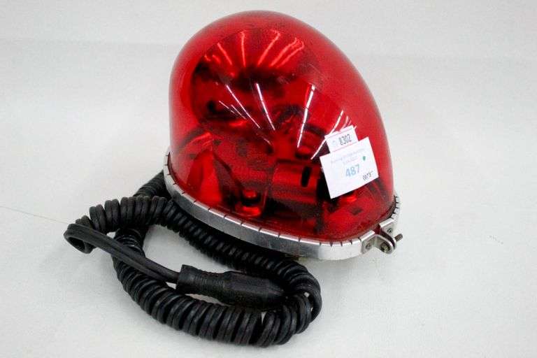 Vehicle flashing red light with cigarette lighter attachment. Bunting