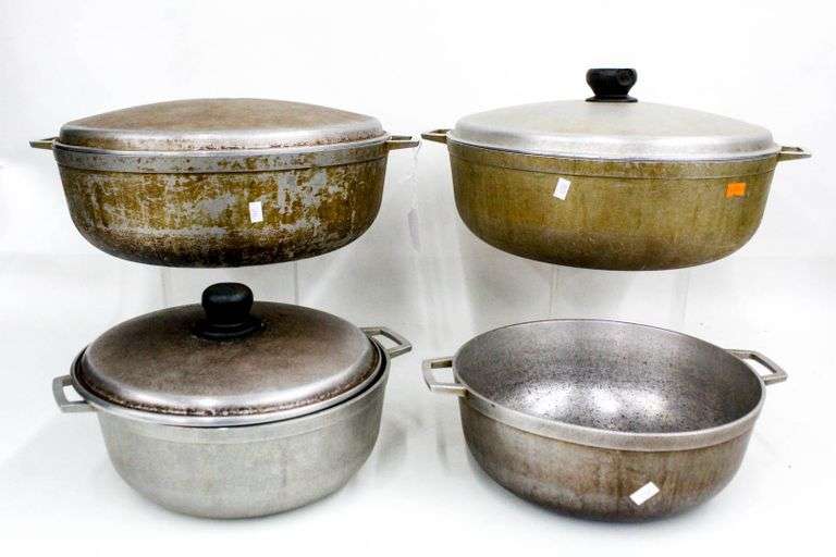 Large aluminum cooking pot collection, includes Imusa. Four pots, three